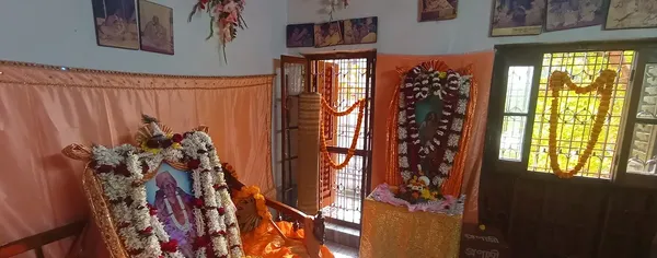 Temple & Worship: The shrine interior, its deities dressed and garlanded for worship