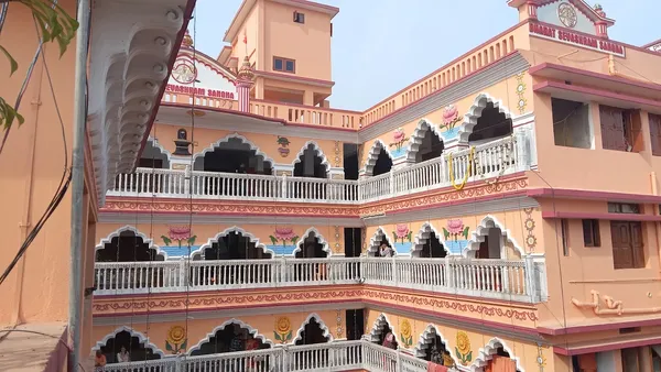 Our Premises: The upper storeys and arched balconies of the Bharat Sevashram Sangha courtyard